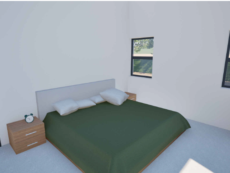 A bedroom featuring neutral walls, casement windows, and a dark internal door.
