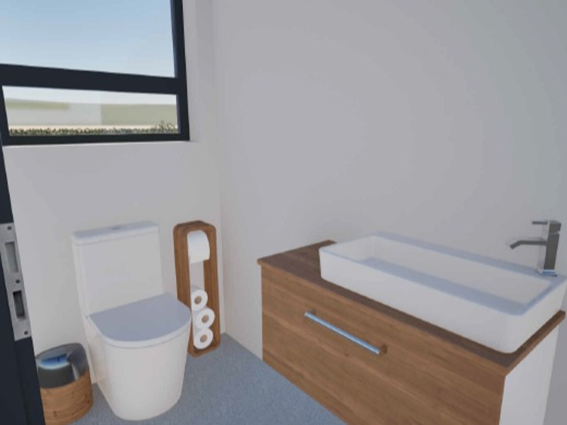 A modern, minimalist bathroom featuring a wall-mounted vanity with a vessel basin and a sleek toilet.