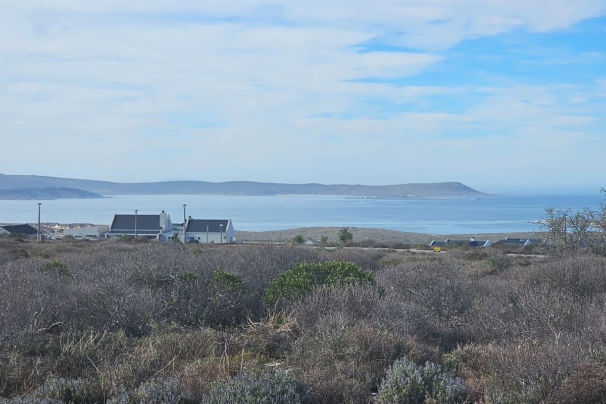A scenic view overlooking the coastal landscape and ocean from the vacant residential property.