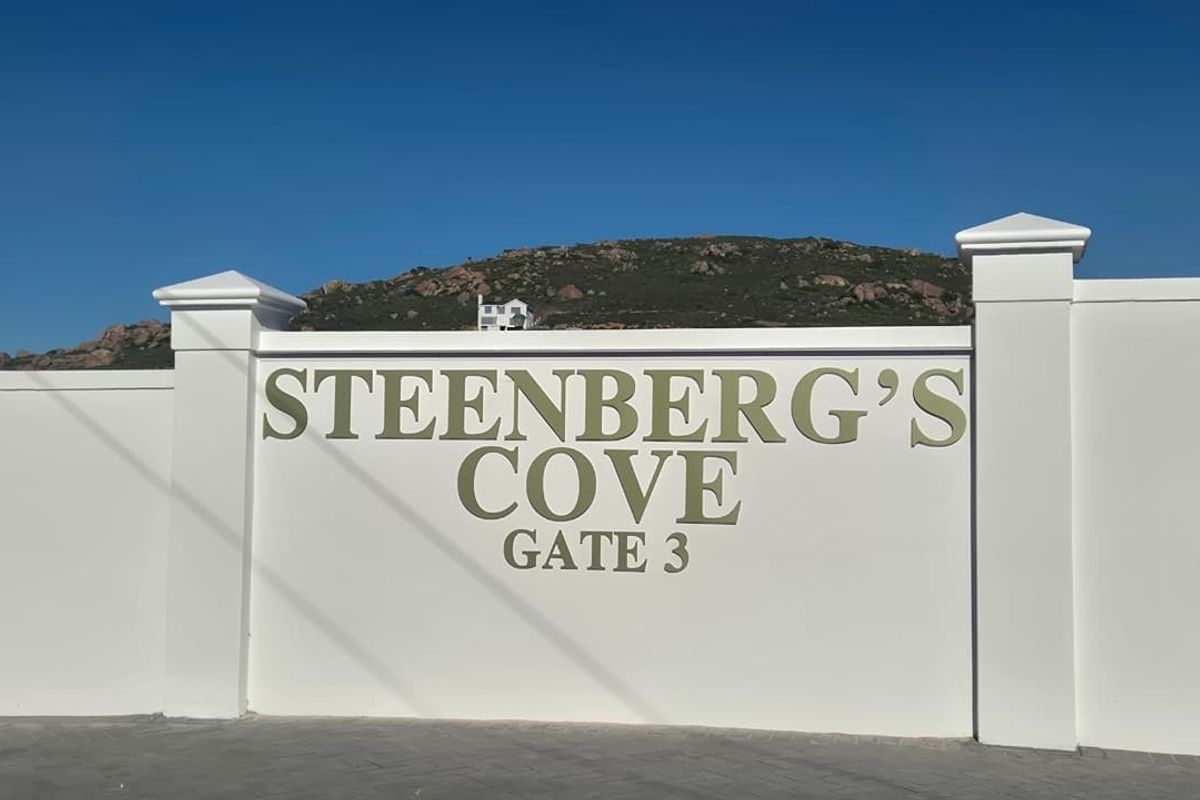 A clear view of the Steenberg's Cove Gate 3 entrance signage and boundary wall structure.