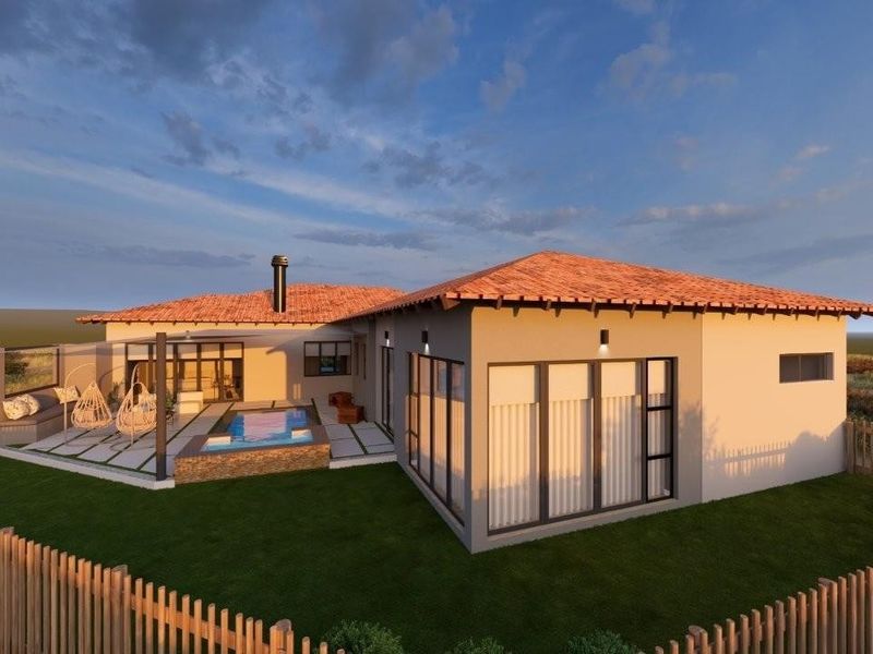 A rear exterior view of a modern house featuring a tiled roof, a swimming pool, a patio area, and large sliding glass doors.