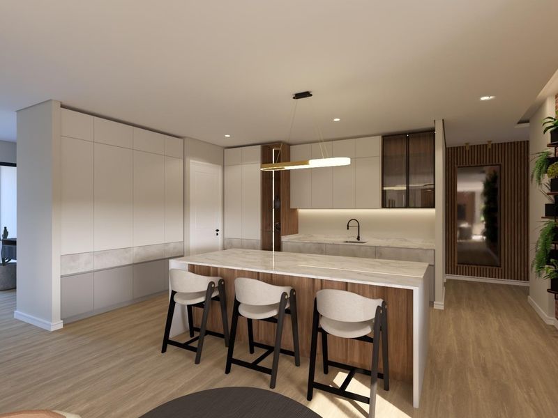 Modern kitchen featuring a central island with stone countertop, sleek built-in cabinetry, under-cabinet lighting, and a stylish exposed brick feature wall.