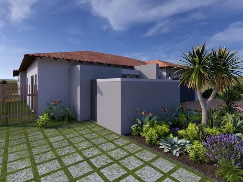 A modern residential exterior featuring a tiled roof, paved driveway, and landscaped garden area.