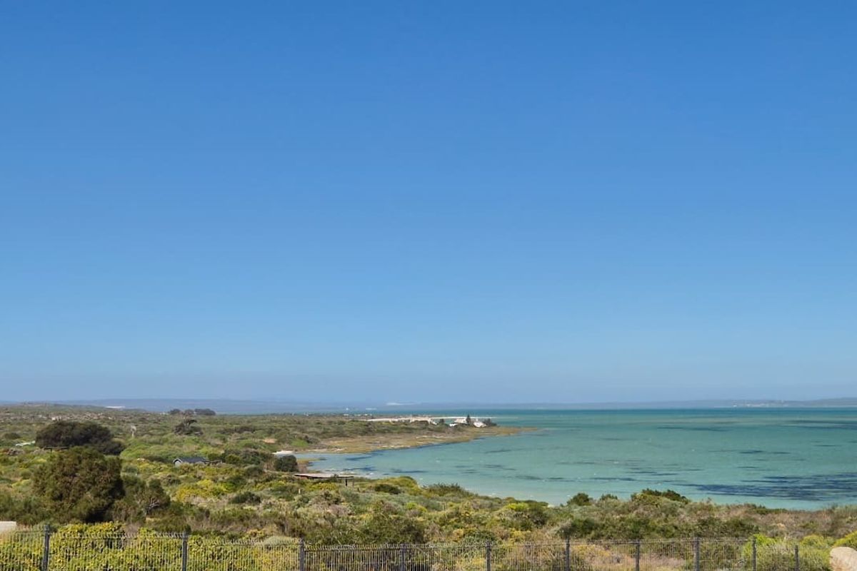 A scenic view of the coastal landscape and lagoon, showcasing the natural surroundings of the vacant residential property.