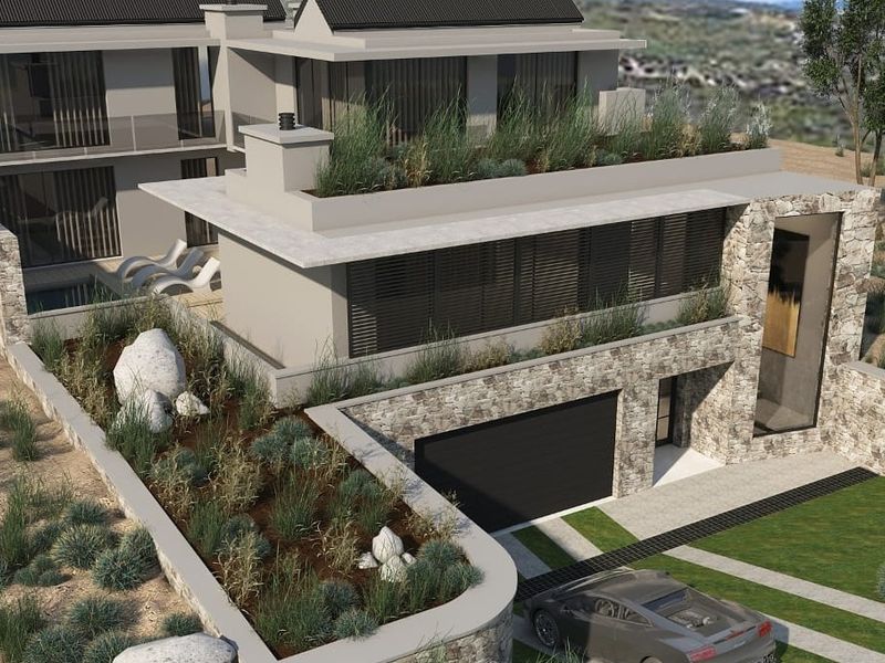 A modern architectural rendering of a multi-level residential property featuring stone cladding, integrated roof gardens, and a private driveway.