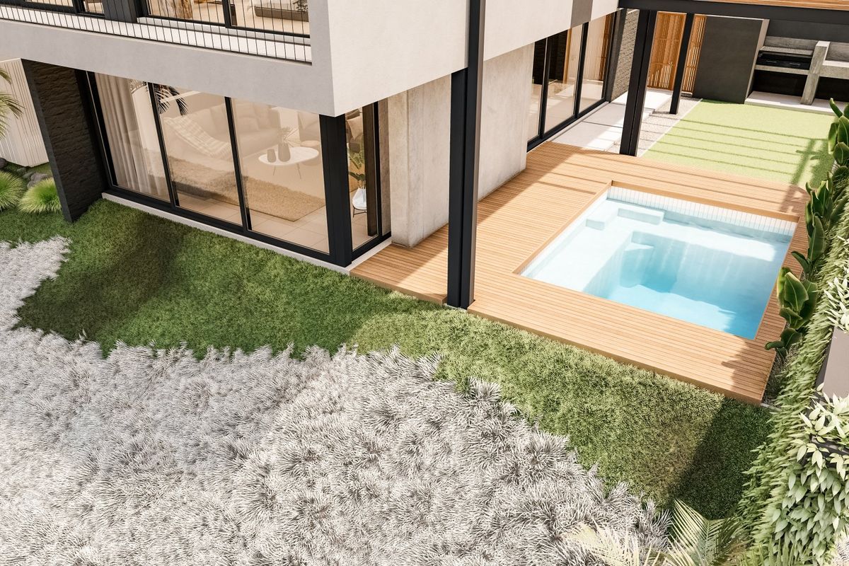 An elevated view of a modern backyard featuring a plunge pool with timber decking, landscaped garden areas, and seamless indoor-outdoor flow.