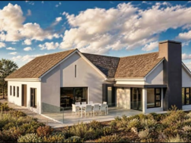 A modern rear elevation featuring a paved patio, glass balustrade, and large sliding doors, set against a landscaped garden with a prominent chimney.