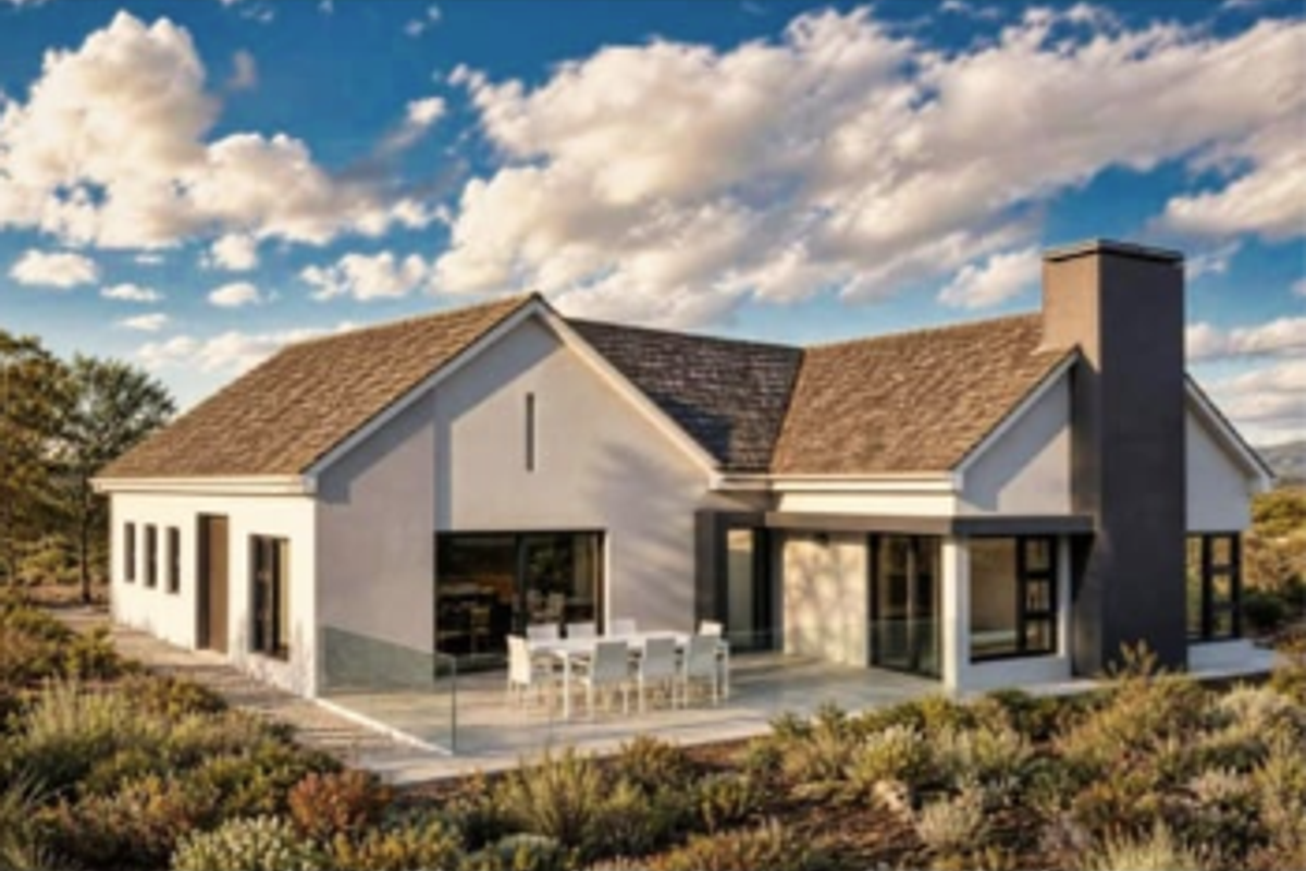 A modern rear elevation featuring a paved patio, glass balustrade, and large sliding doors, set against a landscaped garden with a prominent chimney.