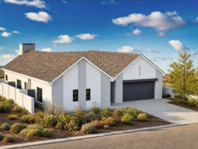 A modern single-story residential home featuring a clean facade, attached garage, and landscaped front yard with a perimeter wall.