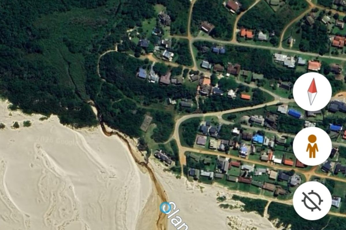 An aerial satellite view showing the residential area and coastal landscape near Oyster Bay Beach.