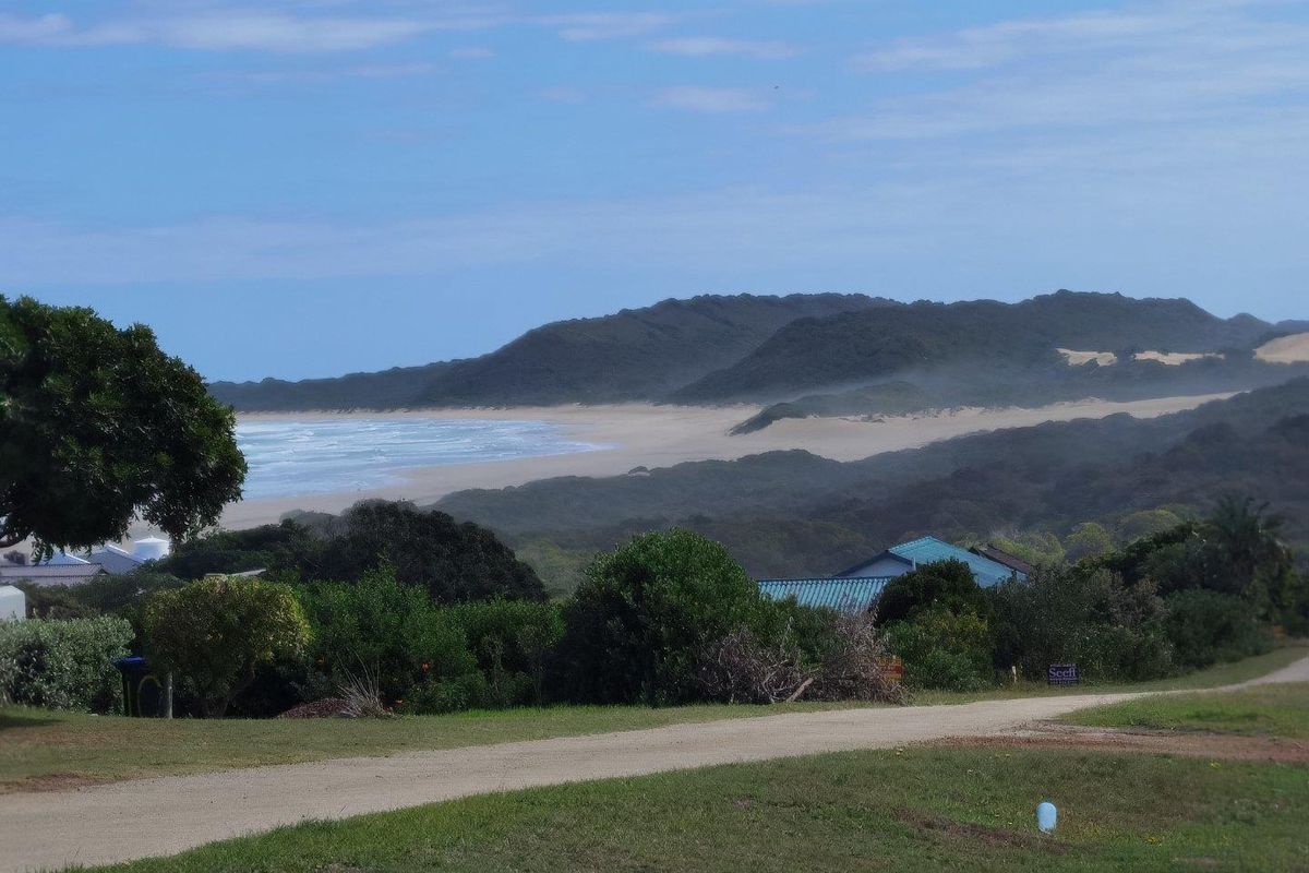 A scenic view of the coastline and surrounding landscape from the vacant residential property.