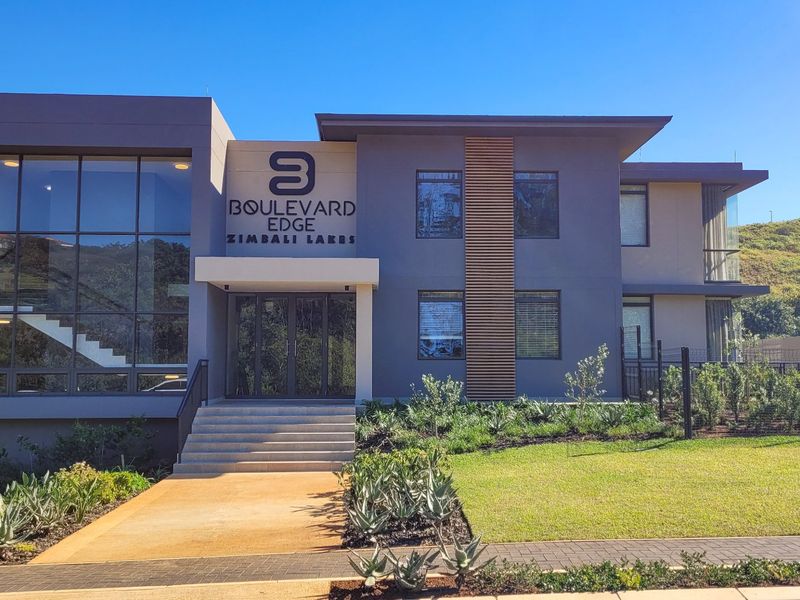 Modern exterior facade of Boulevard Edge at Zimbali Lakes, featuring contemporary architectural design, glass elements, and well-maintained landscaped grounds.