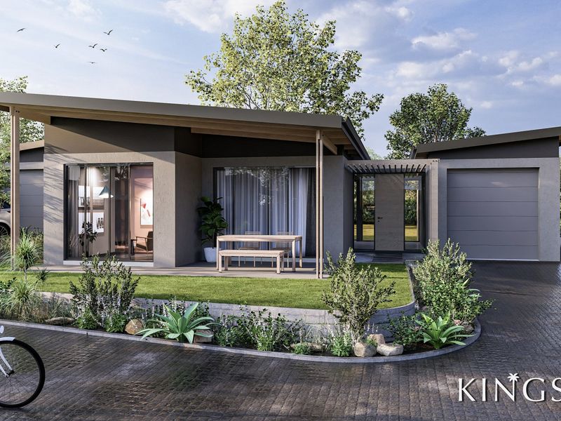 Modern single-story home featuring a covered patio, paved driveway, integrated garage, and landscaped front garden with contemporary architectural design.