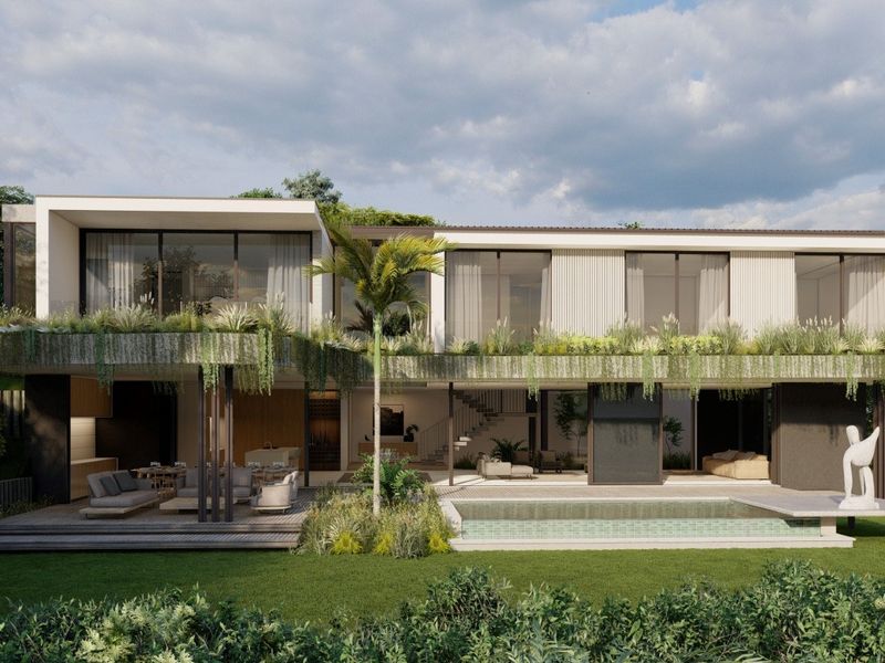 Modern luxury rear elevation featuring a swimming pool, expansive timber decking, covered patio area, and lush integrated balcony planters.