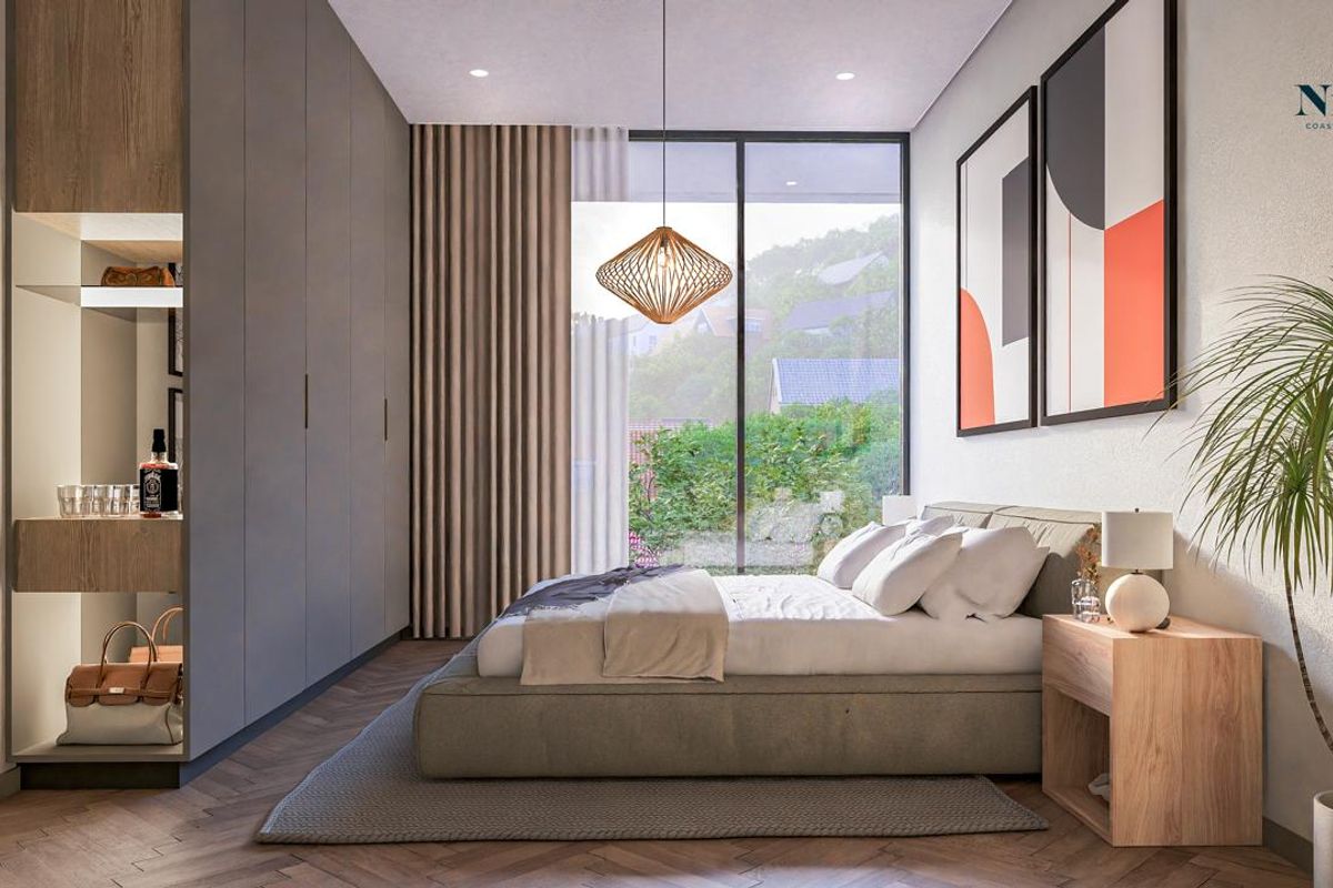 Modern bedroom featuring floor-to-ceiling built-in wardrobes, herringbone timber flooring, and large glass sliding doors opening to an outdoor view.