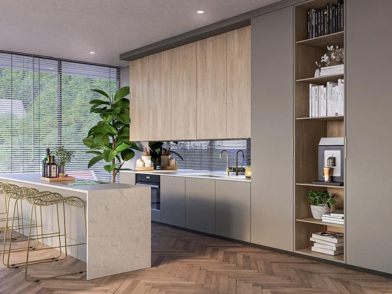 Modern open-plan kitchen featuring sleek cabinetry, a stone-topped island, integrated appliances, and herringbone timber flooring with large windows.