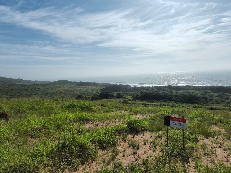 A scenic view of the coastal landscape and ocean from the vacant residential land plot.
