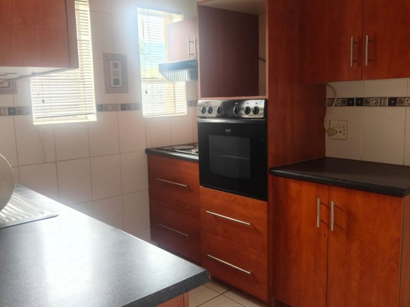 This lovely unit is located in a secure complex walking distance to town. - Photo 4