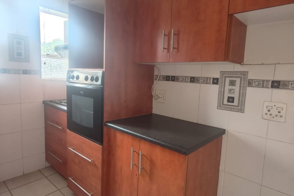 This lovely unit is located in a secure complex walking distance to town. - Photo 2