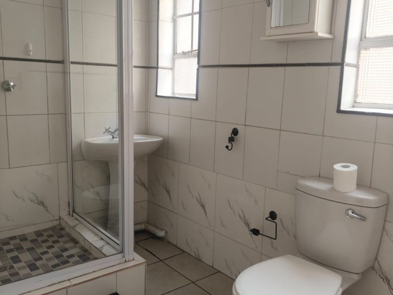 This lovely unit is located in a secure complex walking distance to town. - Photo 8