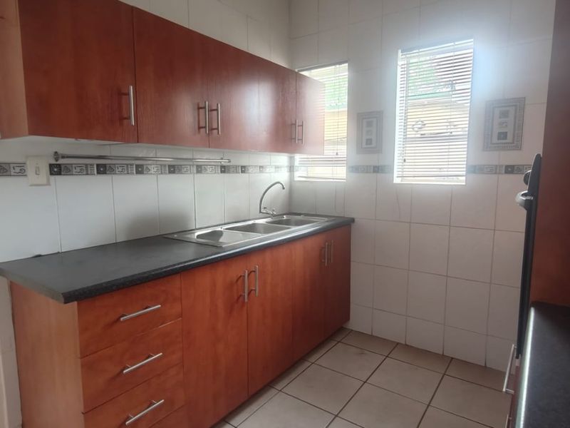 This lovely unit is located in a secure complex walking distance to town. - Photo 7