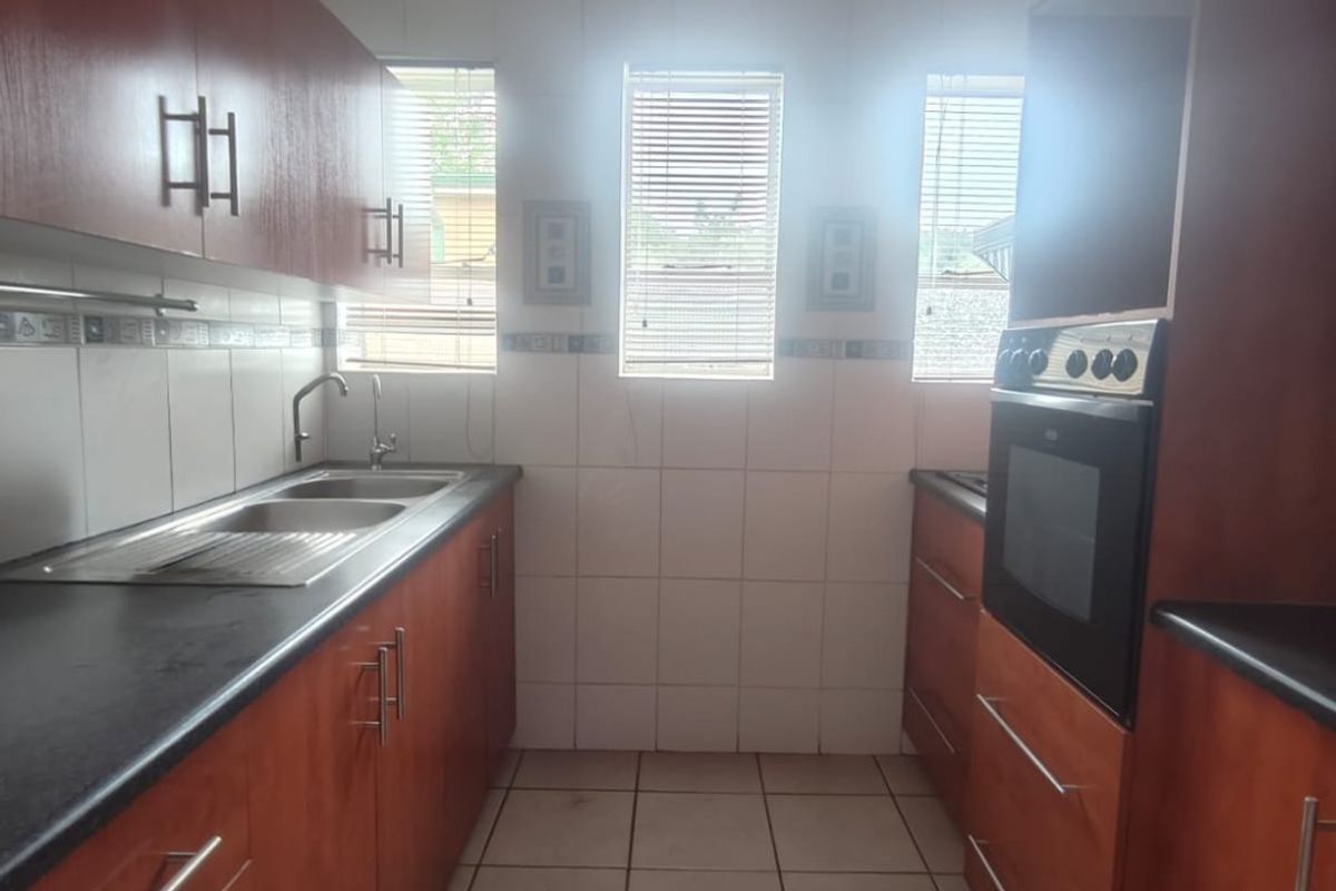 This lovely unit is located in a secure complex walking distance to town. - Photo 3