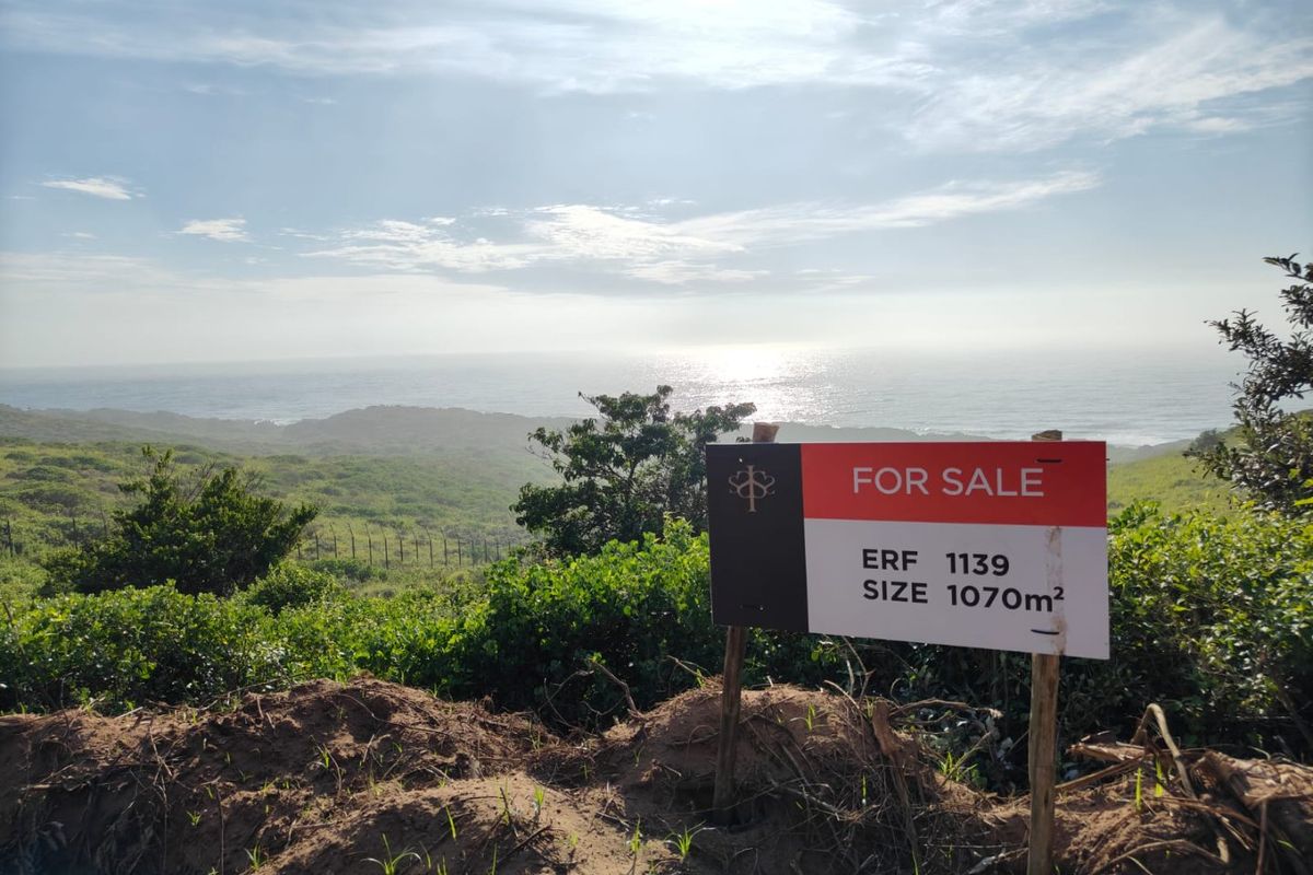 A scenic view of the coastline and ocean from the vacant residential erf, showcasing the natural landscape and elevated position.
