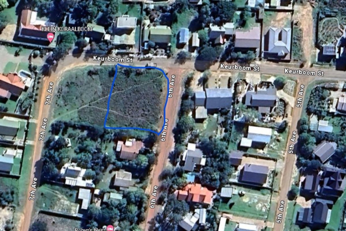 Aerial view of a vacant residential plot located at the corner of Keurboom Street and 6th Avenue, featuring natural vegetation and surrounding residential development.