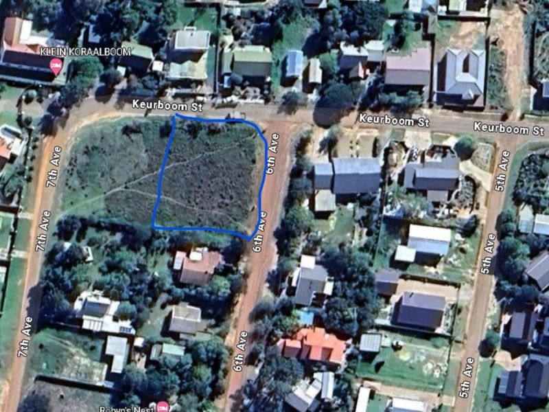 Aerial view of a vacant residential plot located at the corner of Keurboom Street and 6th Avenue, featuring natural vegetation and surrounding residential development.