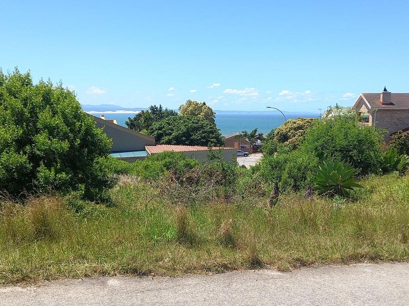 A view of the surrounding coastal landscape and neighborhood from the vacant residential land.