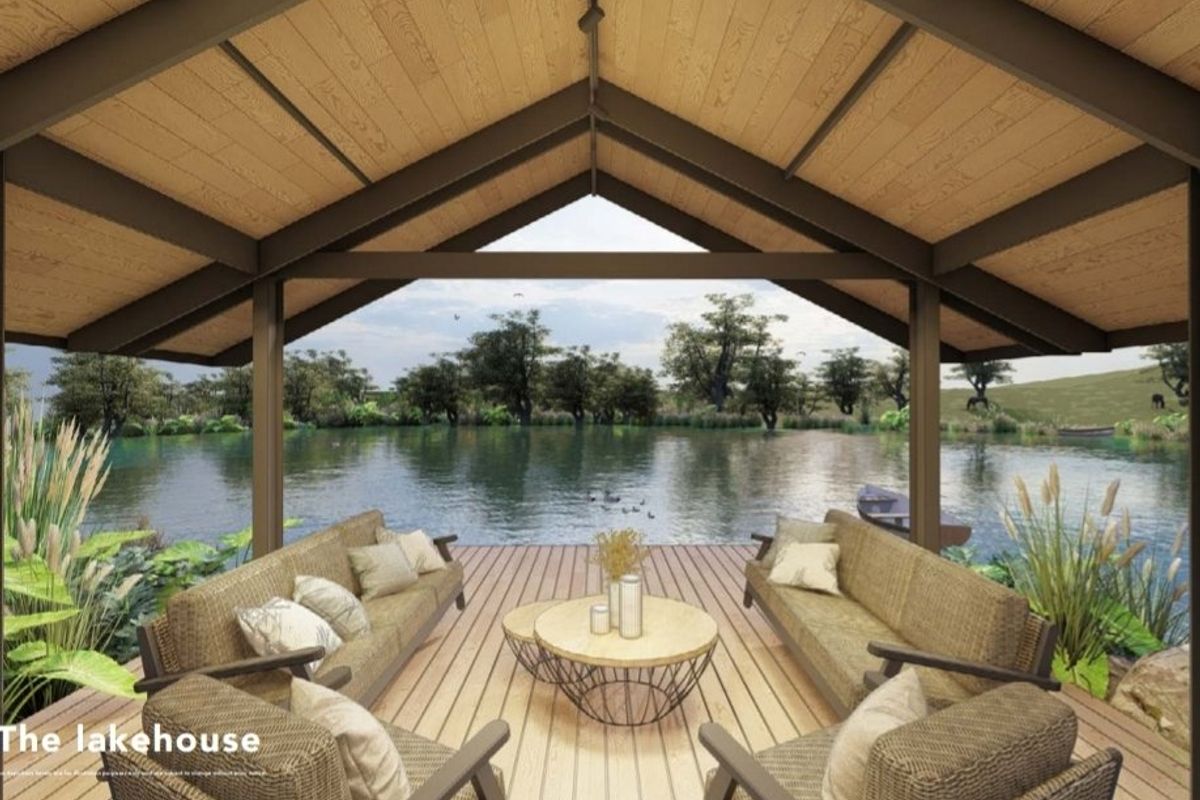 A rendered view of a covered lakeside deck featuring timber decking and a vaulted ceiling, offering serene water views.