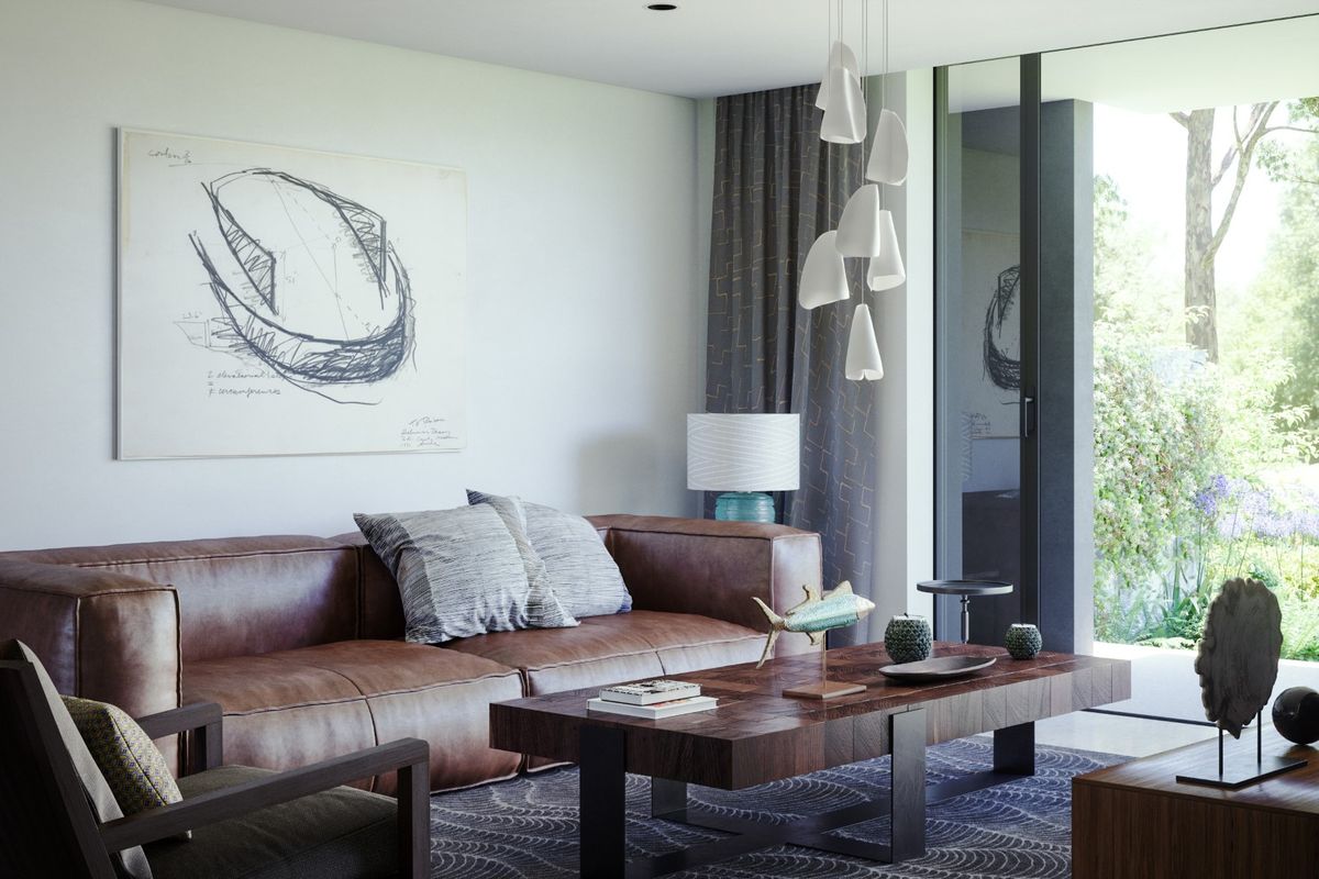 A modern, well-appointed living room featuring large sliding glass doors that provide seamless access to the outdoor garden area.