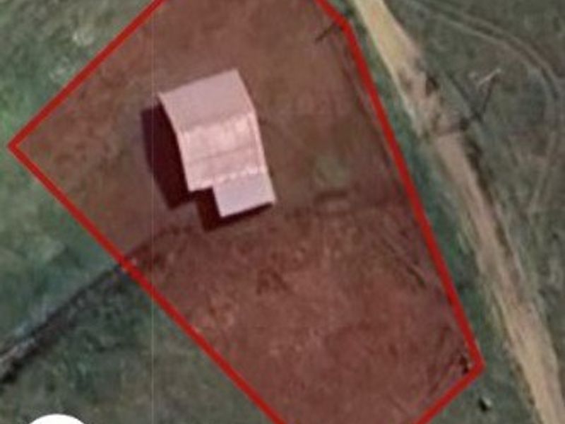 Aerial satellite view showing the property boundary and the roof structure of the house on the plot.
