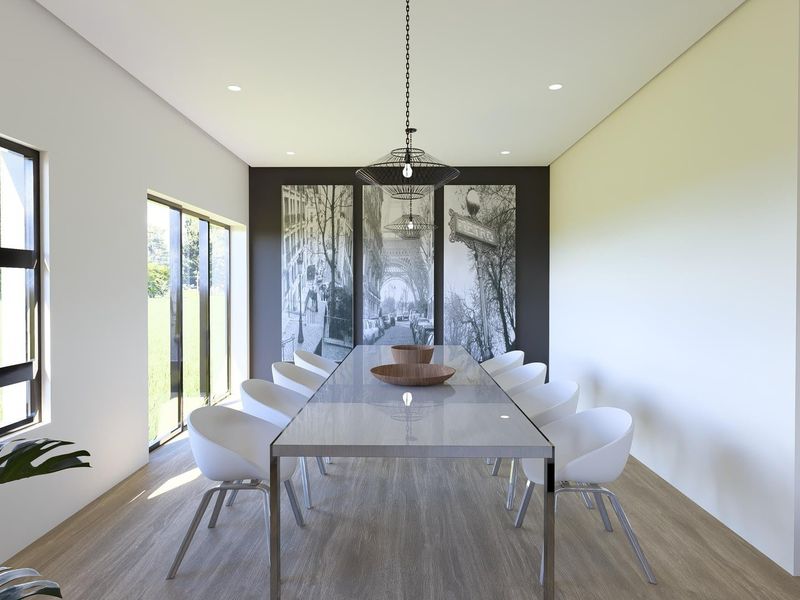 Modern dining room featuring timber-look flooring, recessed downlights, and large windows providing natural light and garden views.