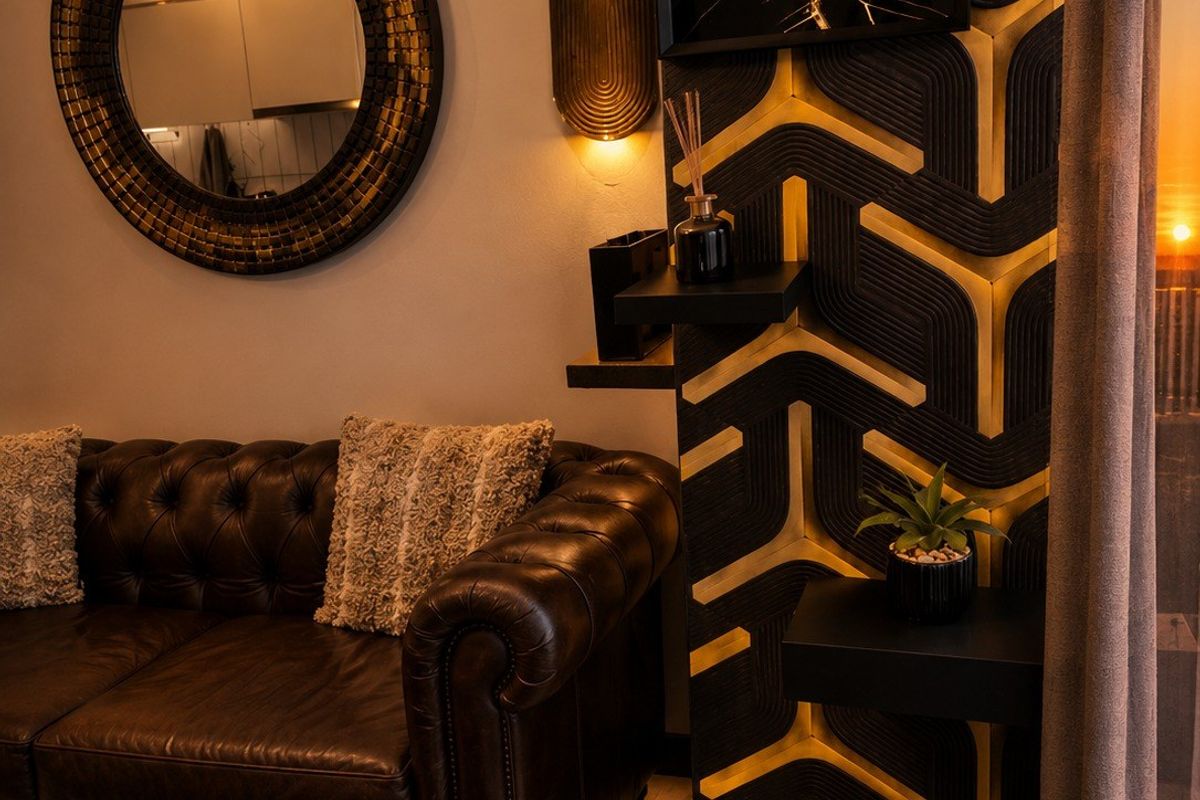 A stylishly appointed living area featuring custom geometric wall paneling, integrated accent lighting, and high-quality finishes.