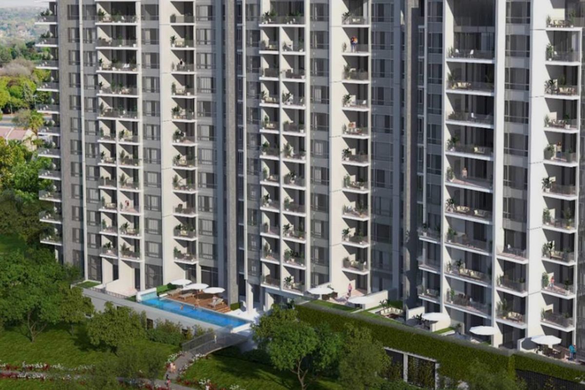 An elevated view of a modern high-rise apartment complex featuring multiple balconies, a swimming pool, and landscaped garden areas.
