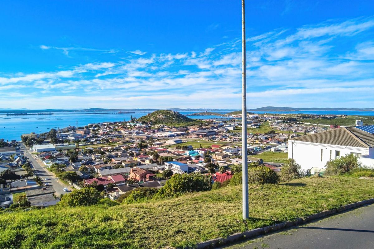 Elevated panoramic view overlooking the coastal town, surrounding landscape, and bay area.