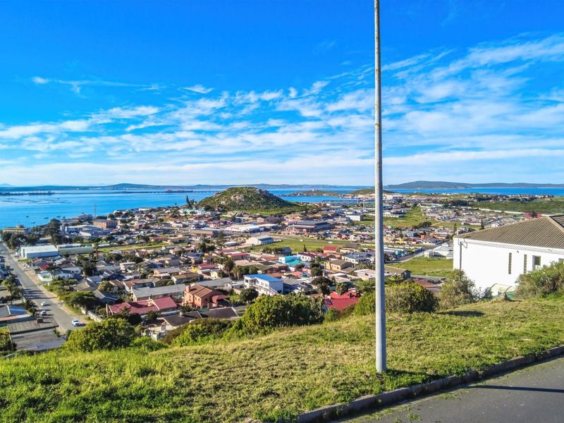 Elevated panoramic view overlooking the coastal town, surrounding landscape, and bay area.