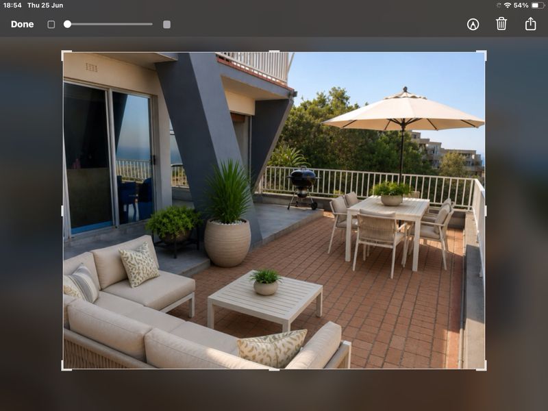 Spacious outdoor balcony featuring tiled flooring, a metal balustrade, and direct access to the interior through large sliding glass doors.