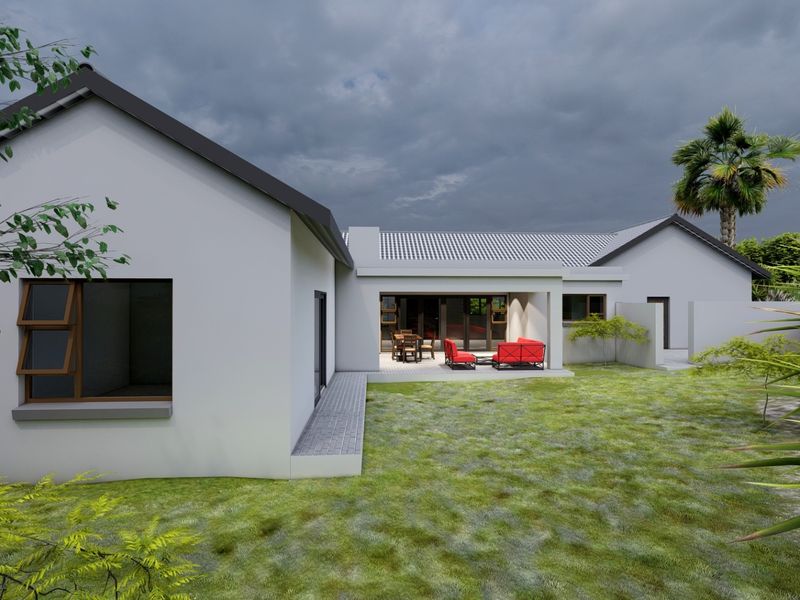 Rear view of a modern house featuring a covered patio, tiled roof, and landscaped garden area.