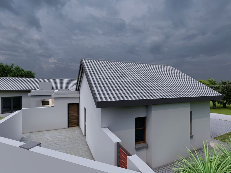 A high-angle view of a modern house exterior featuring a tiled roof, paved patio area, and clean rendered walls.