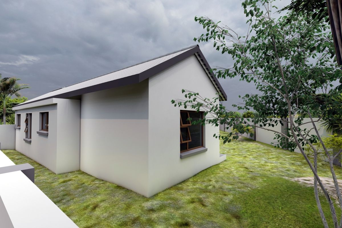 A rear view of the property featuring a clean exterior facade, metal roofing, and a surrounding perimeter wall with a landscaped garden area.