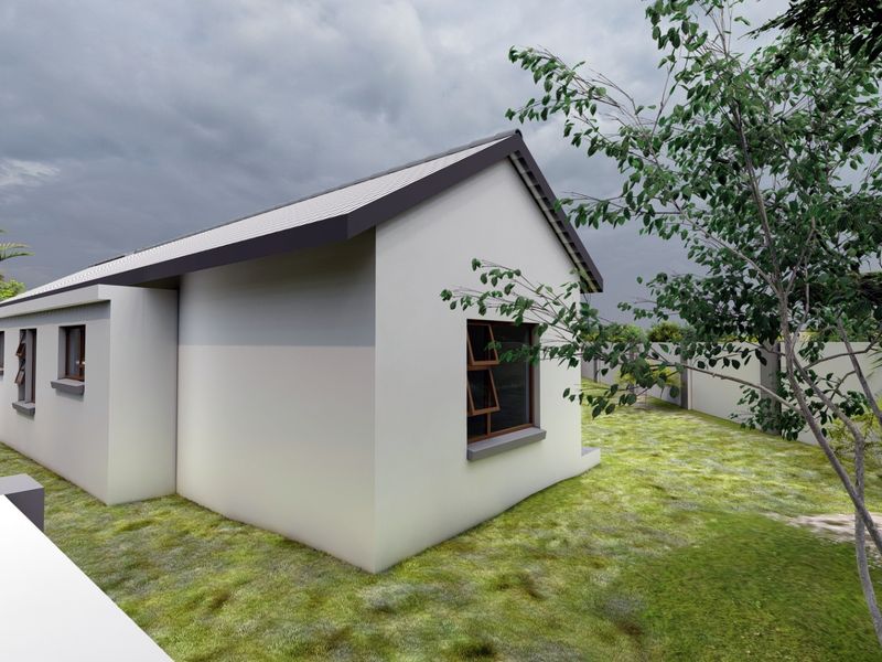 A rear view of the property featuring a clean exterior facade, metal roofing, and a surrounding perimeter wall with a landscaped garden area.