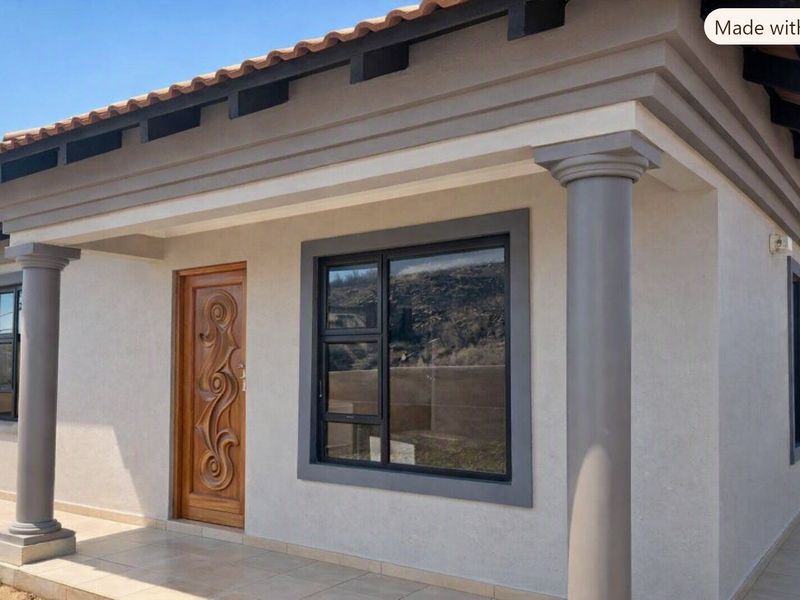 Front facade of a modern house featuring a decorative wooden entrance door, aluminium window frames, and a covered porch with concrete columns.