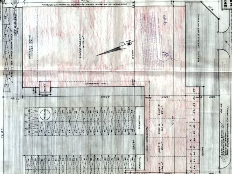 Architectural floor plan for a proposed shopping centre development, detailing site layout, shop units, and parking areas.