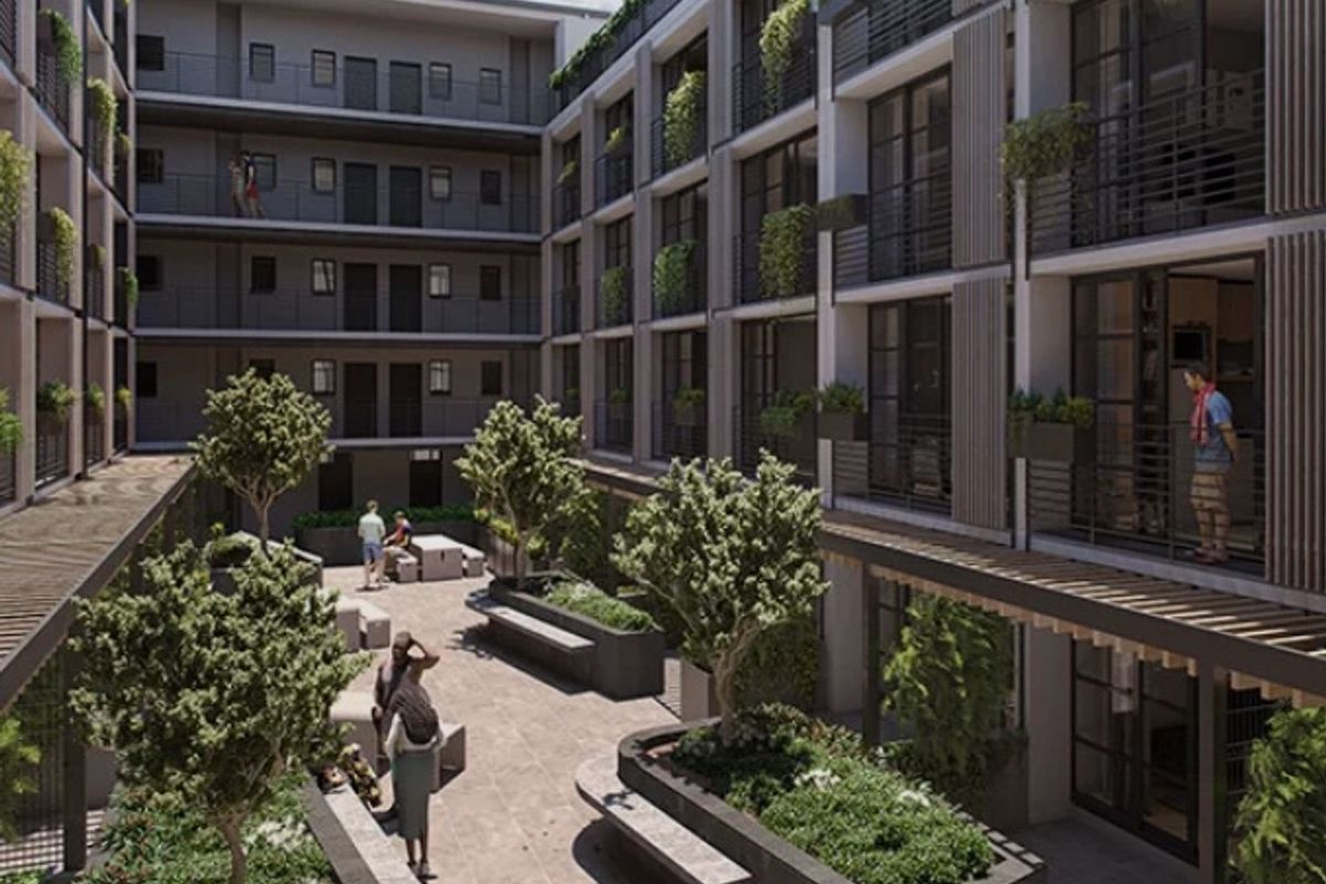 A modern apartment complex courtyard featuring landscaped gardens, raised concrete planters, a pergola, and private balconies overlooking the communal outdoor space.