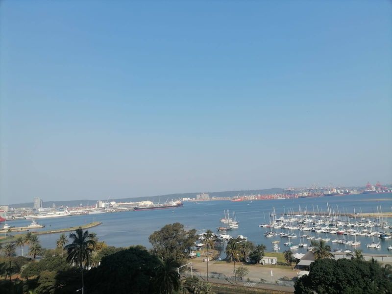 Elevated panoramic view overlooking the harbor, marina, and surrounding coastal landscape.
