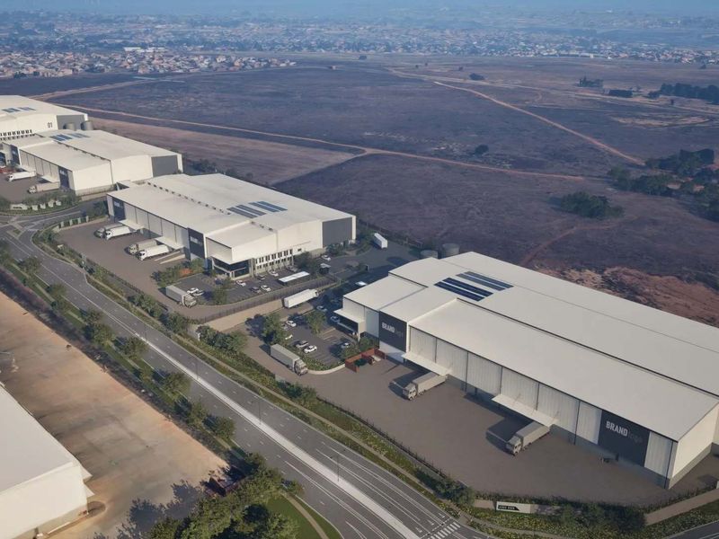 Aerial view of a modern industrial warehouse park featuring multiple large-scale logistics facilities with dedicated loading bays and paved yard access.
