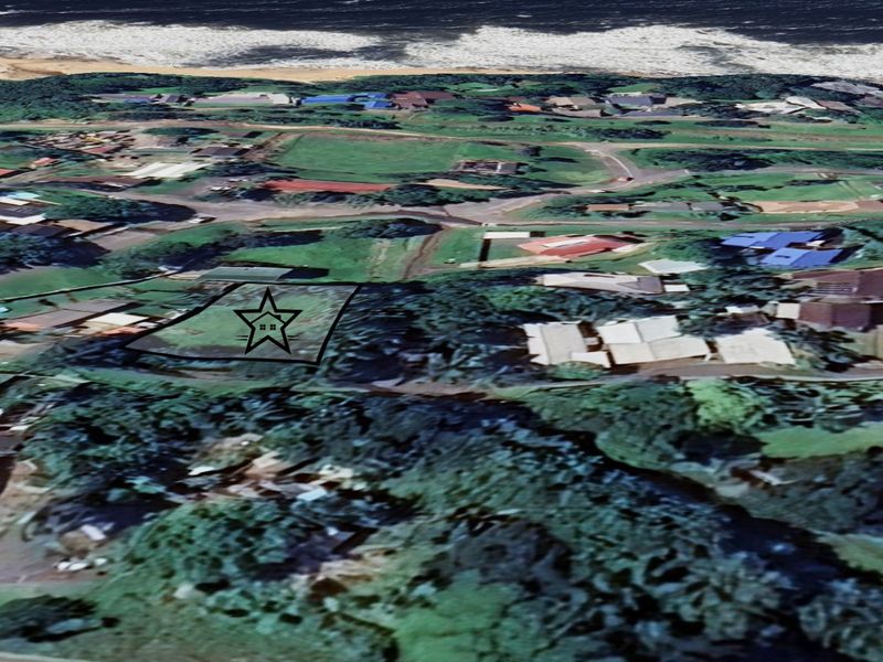 An aerial view of a vacant residential land plot located in a coastal neighborhood, marked with a star for identification.