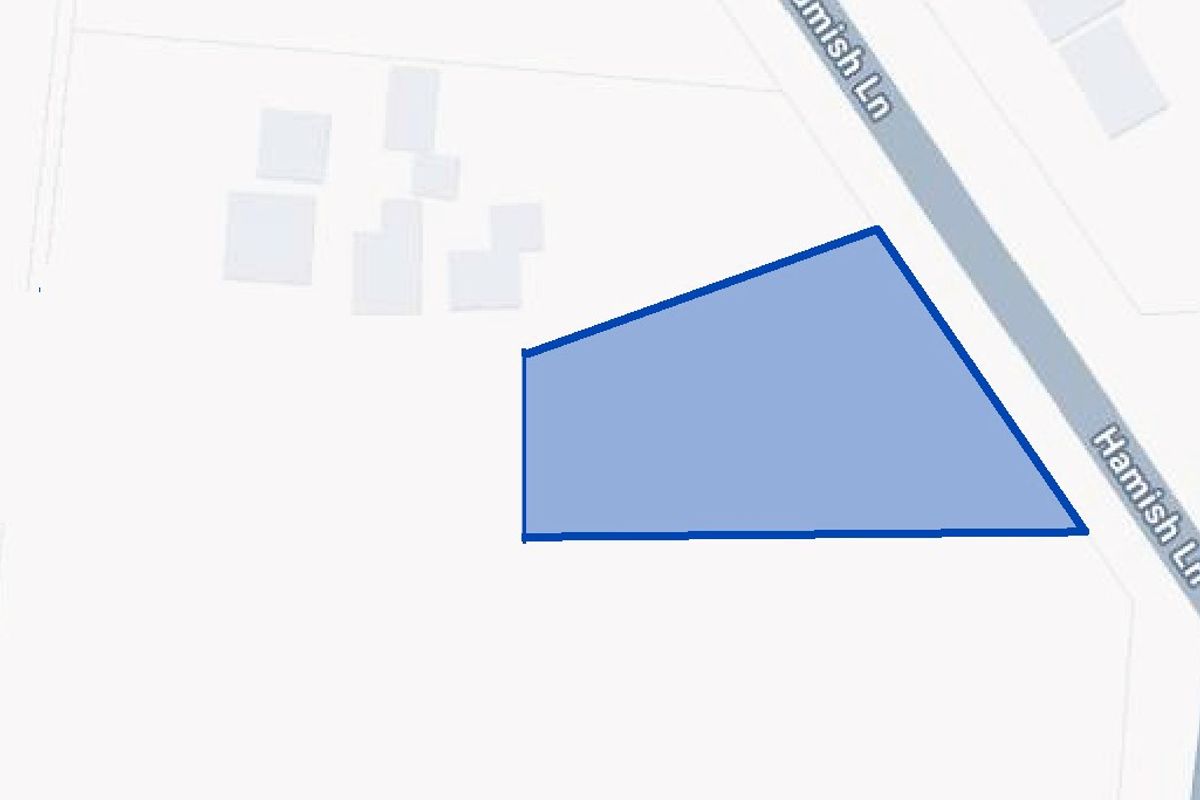 A map view highlighting the boundaries of the vacant residential land plot located along Hamish Lane.